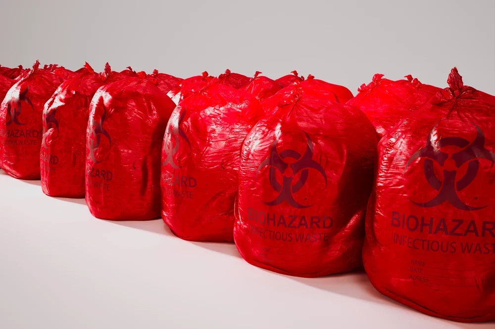Lined up red biohazard bags